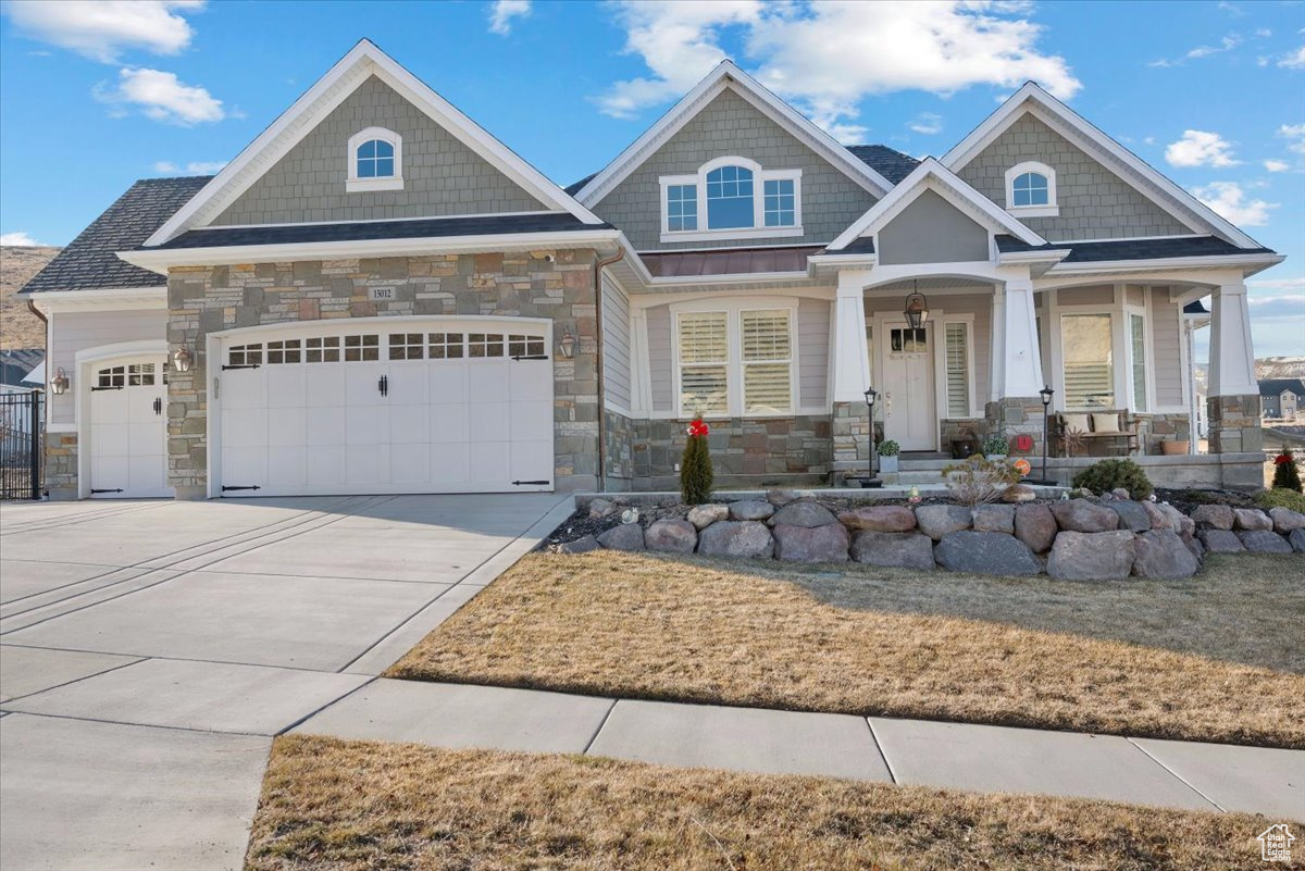 Craftsman house featuring a garage