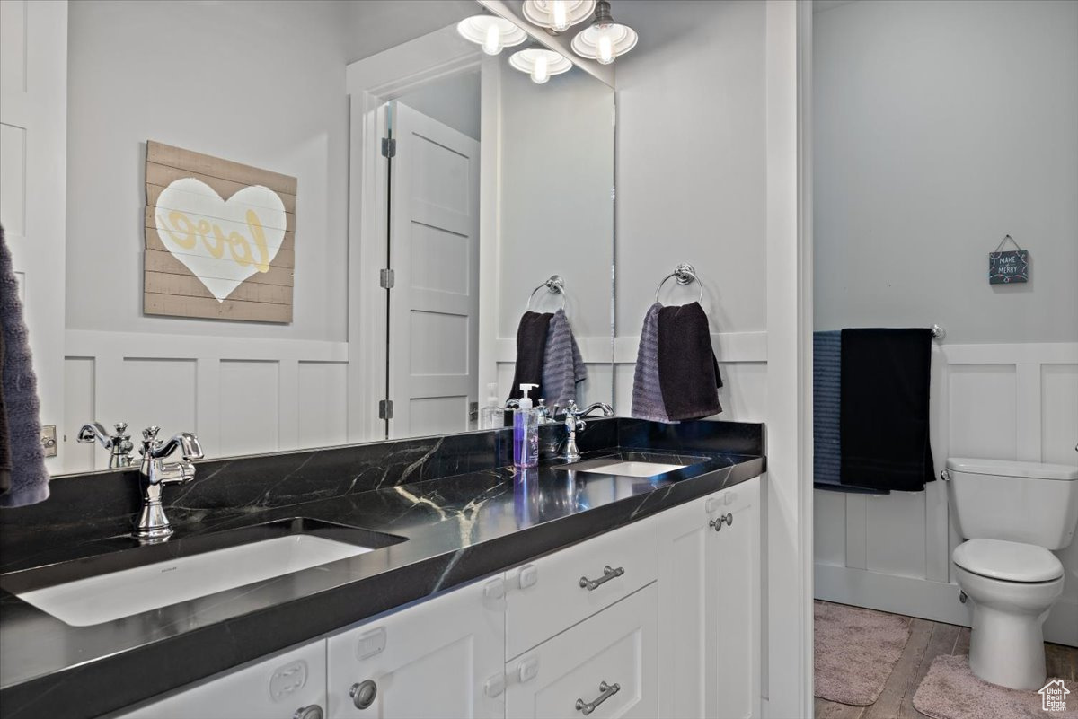 Bathroom featuring vanity and toilet