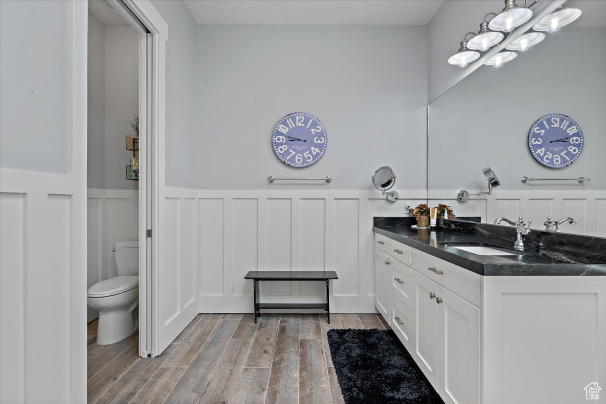 Bathroom featuring vanity and toilet