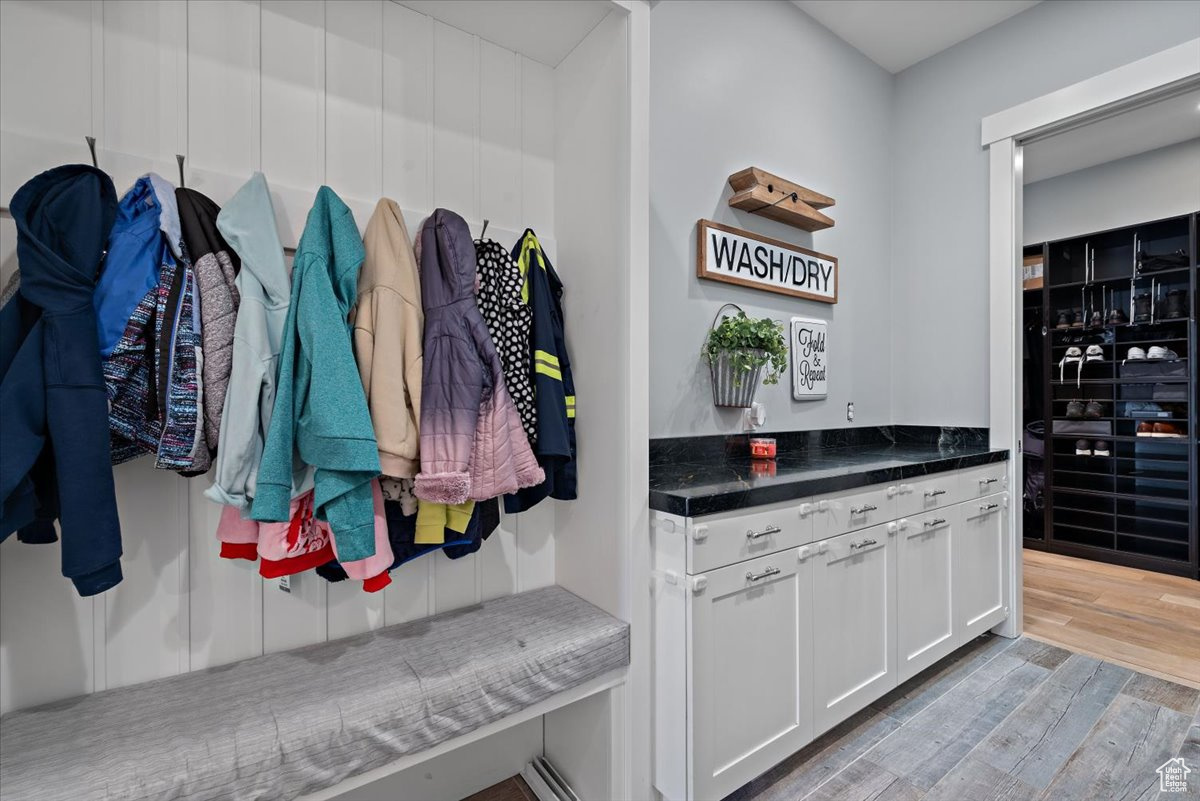 Mudroom with light wood-type flooring