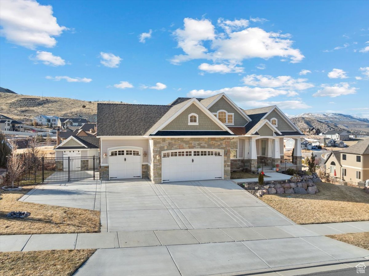 Craftsman house featuring a mountain view and a garage