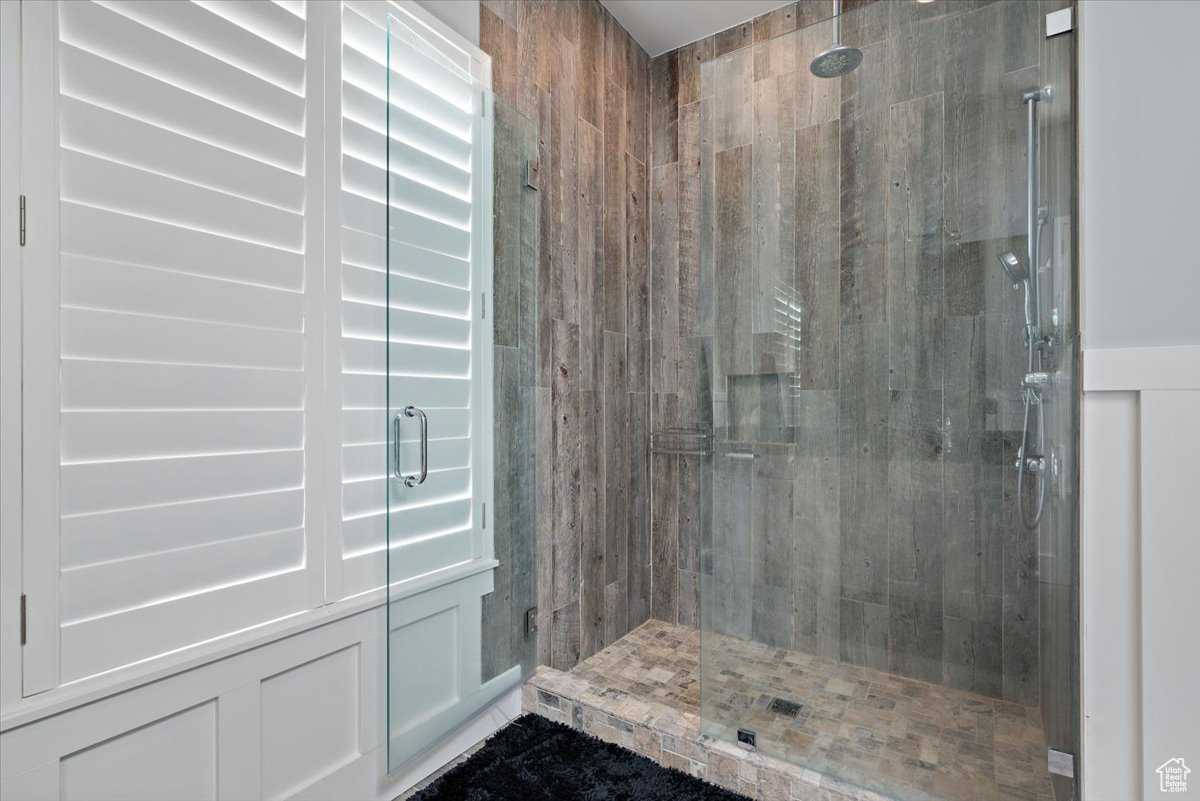 Bathroom with a shower with shower door