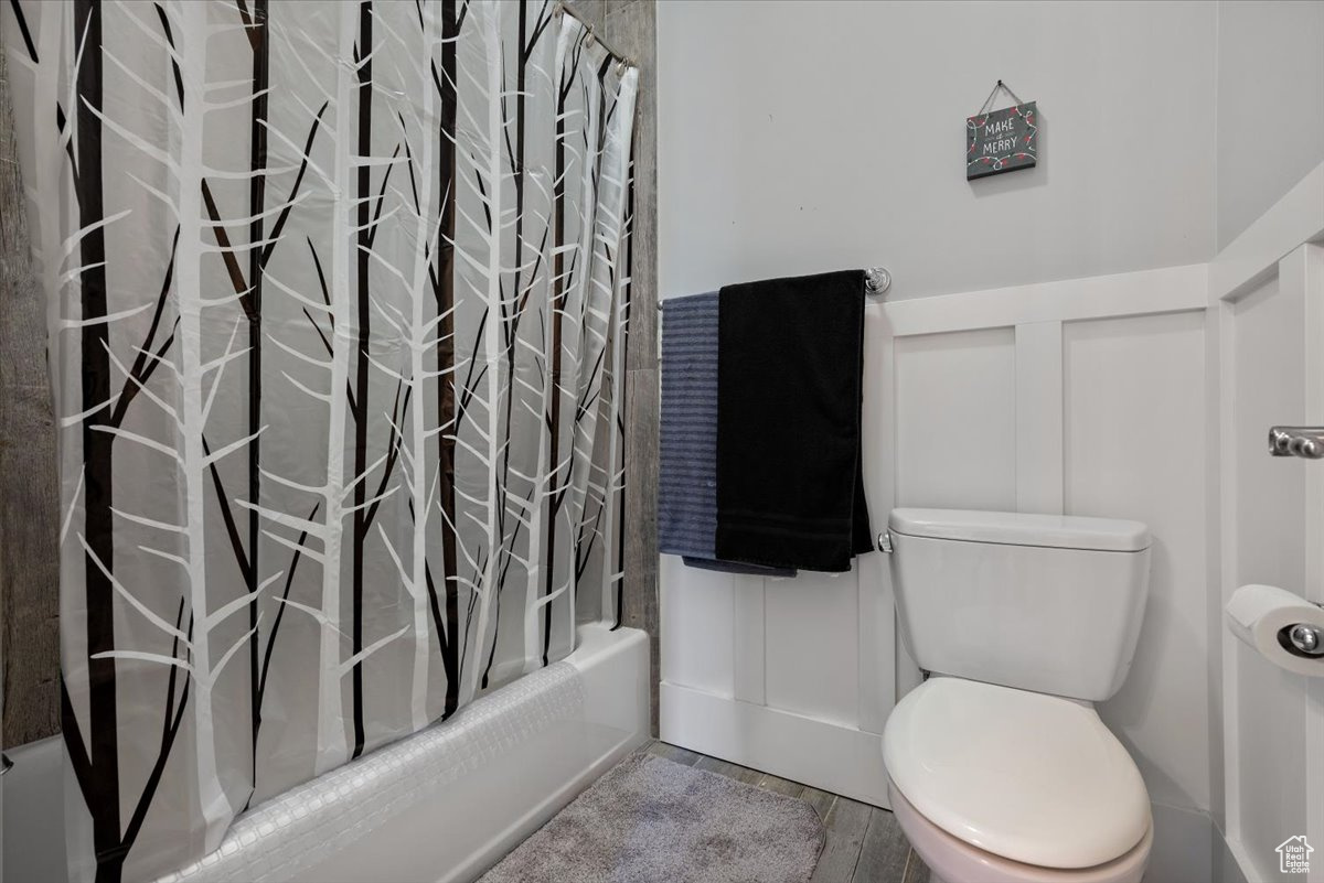 Bathroom with shower / bath combo and toilet