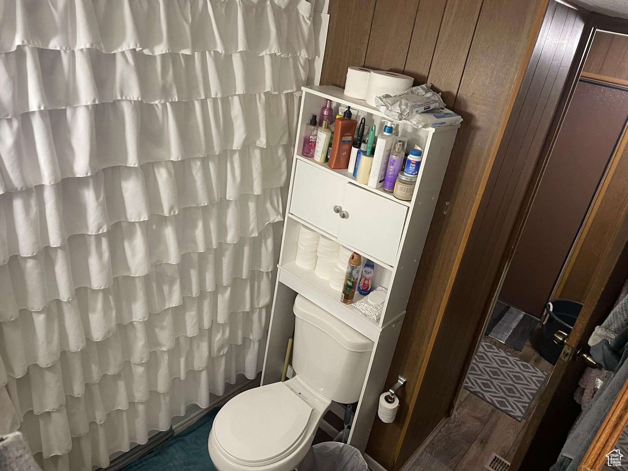 Bathroom with wooden walls and toilet