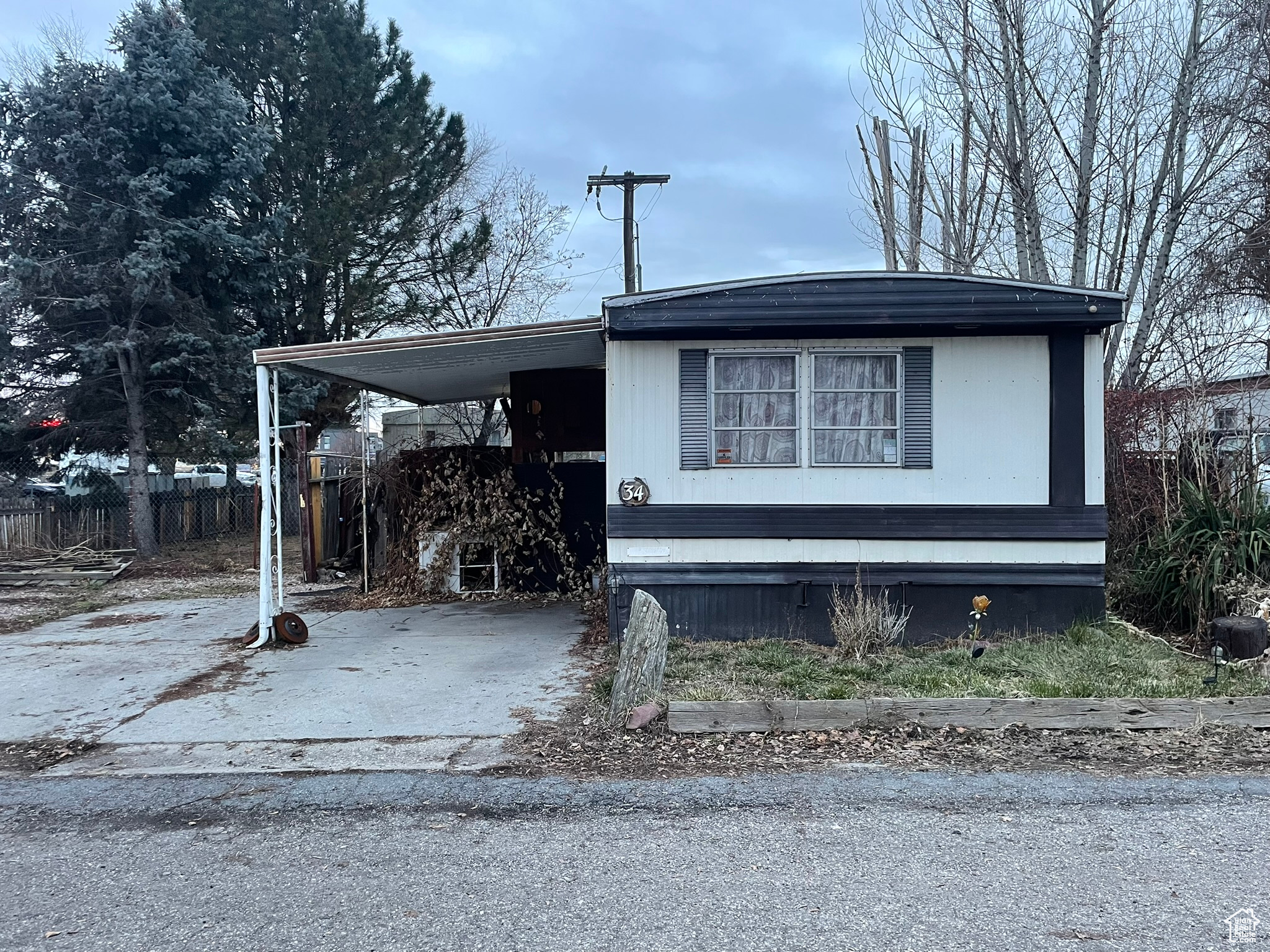 View of front of home featuring a carport