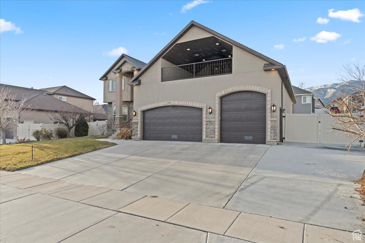 View of front facade with a mountain view and a garage