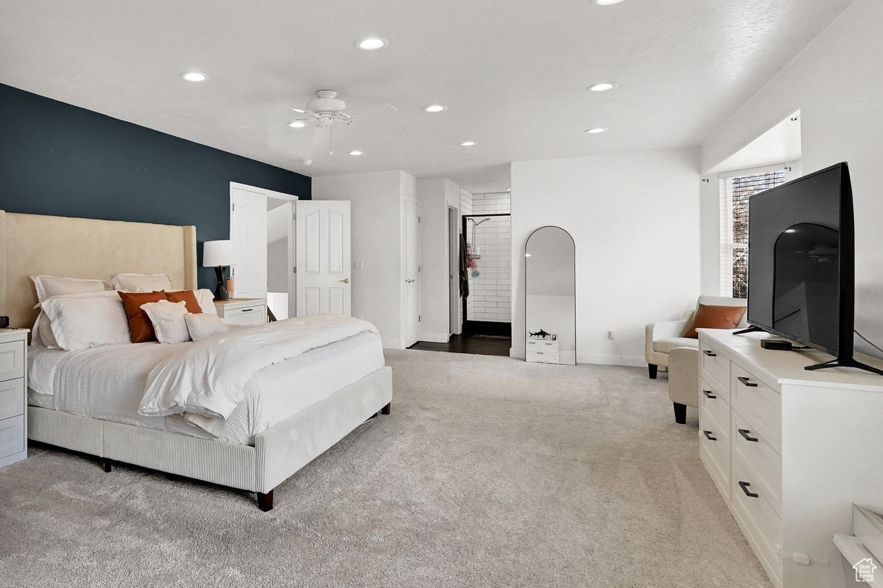 Bedroom featuring ceiling fan and light carpet