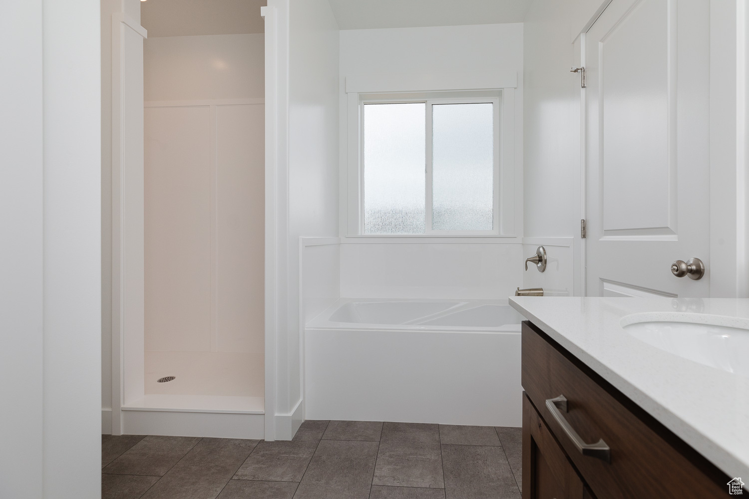 Bathroom with vanity and independent shower and bath