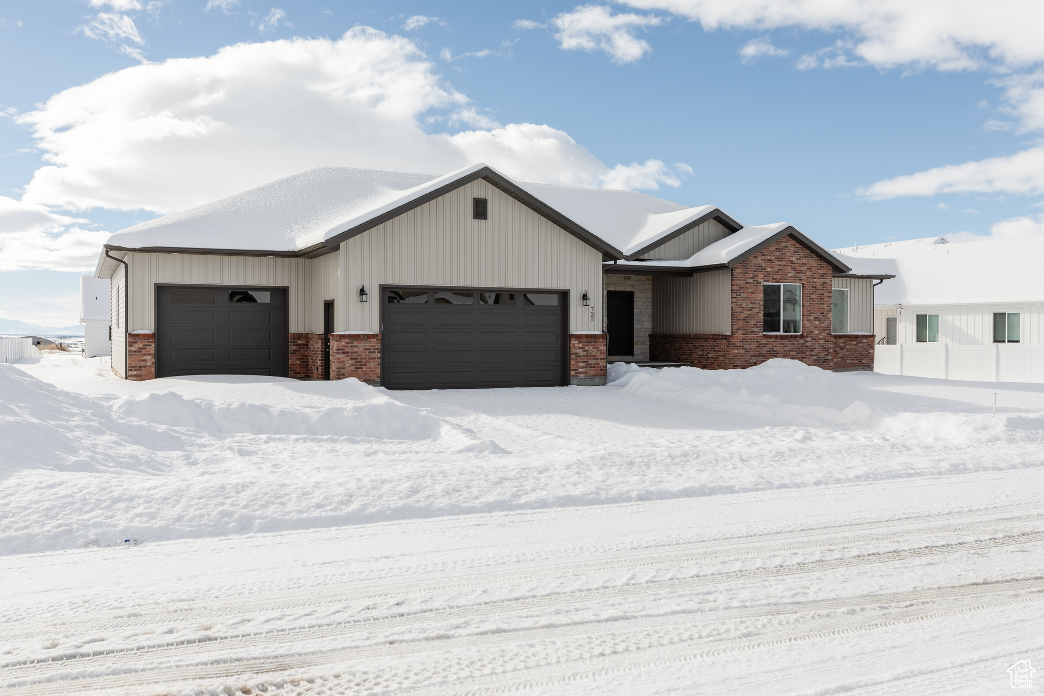 View of front facade featuring a garage