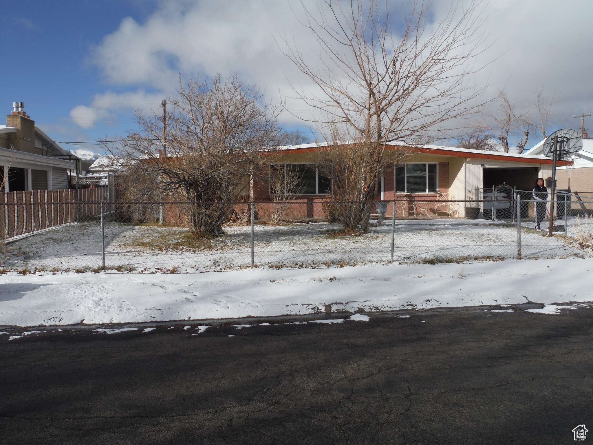 View of front facade featuring a garage