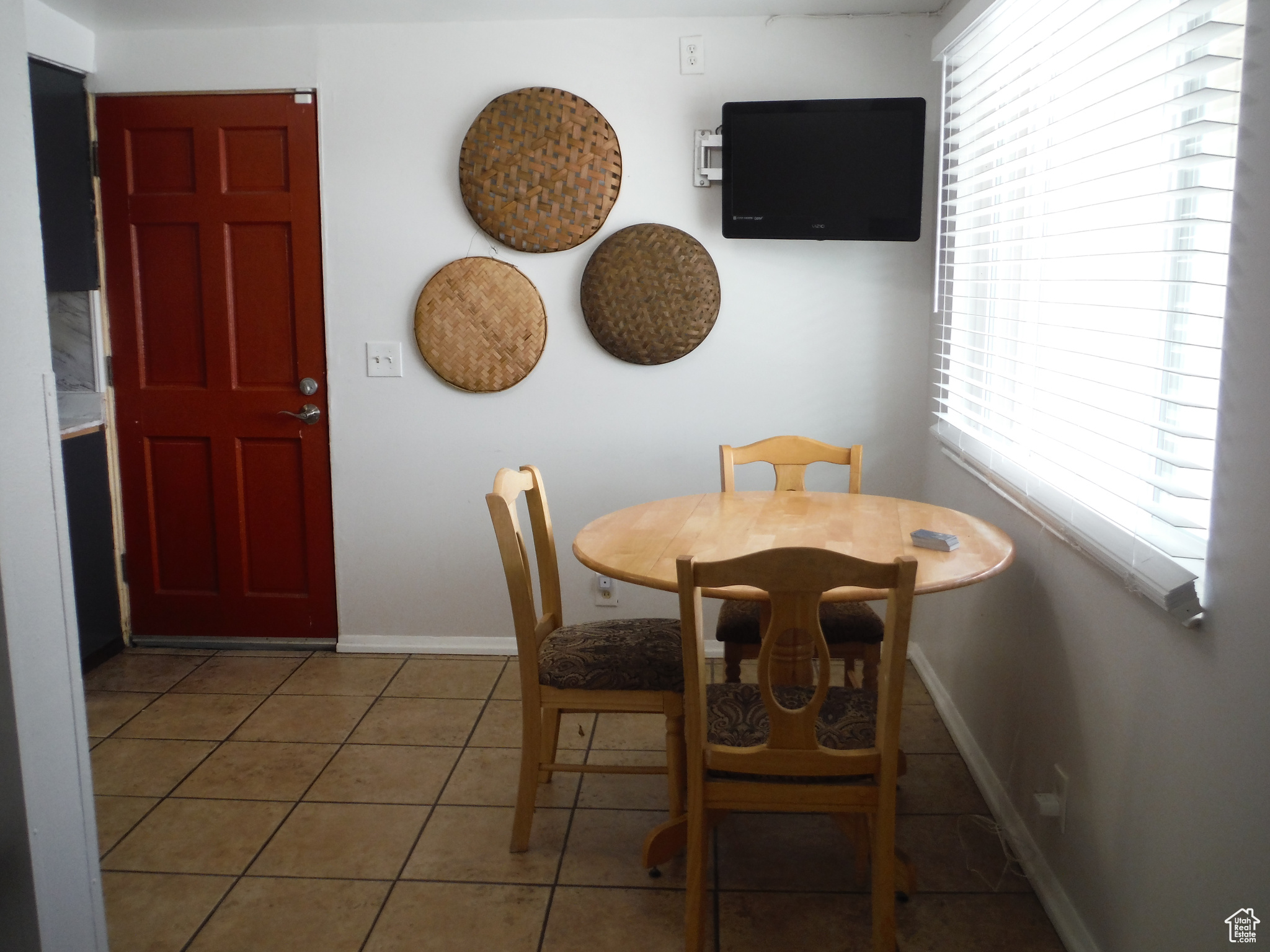 Dining space with tile patterned floors