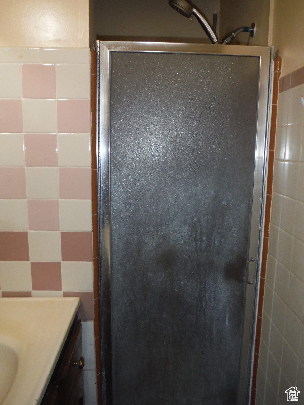 Master Bathroom with vanity and a shower with door