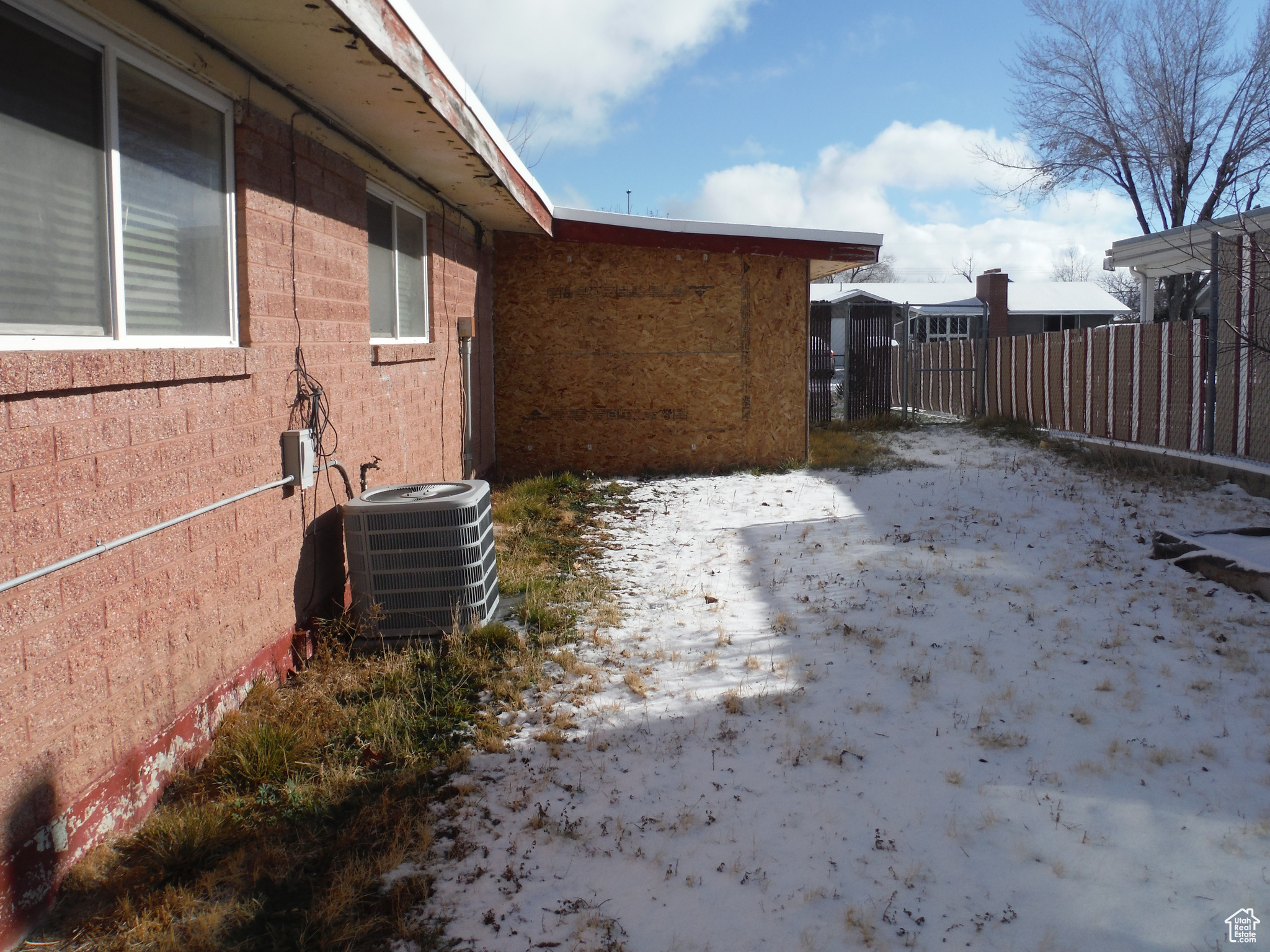 View of side of property with central AC unit
