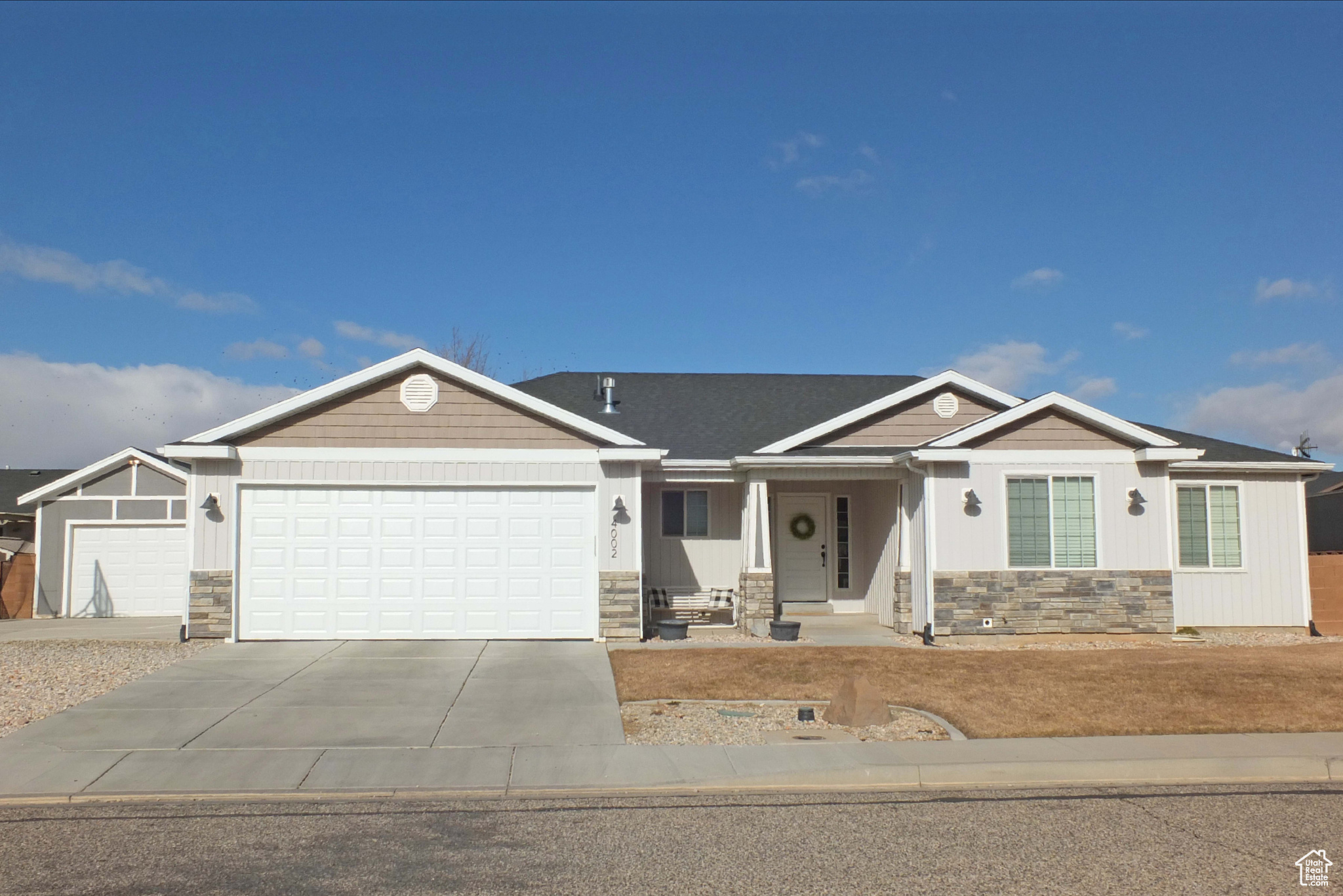 View of front facade featuring a garage