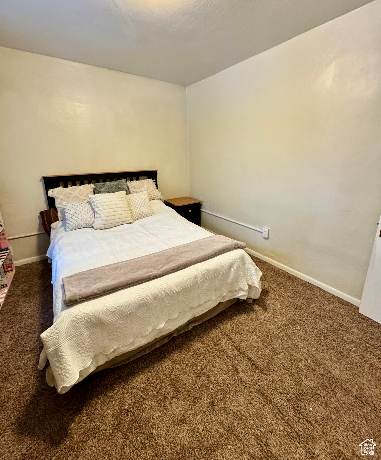 Bedroom with carpet and baseboards