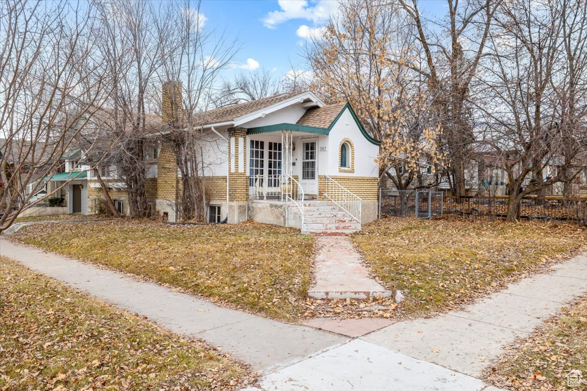 View of front of house with a front yard