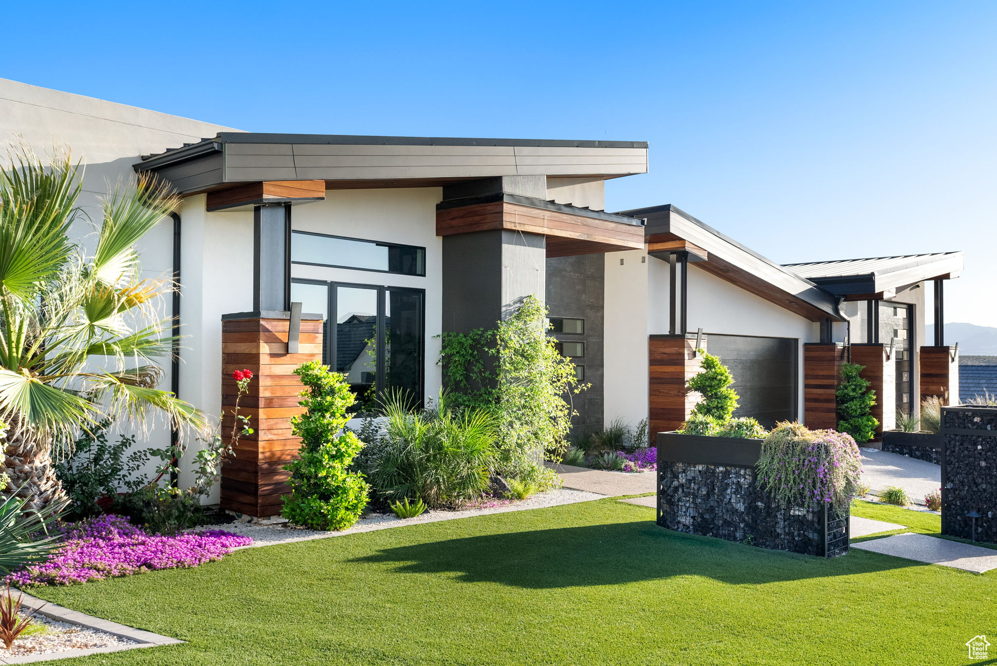 Modern home featuring a front yard