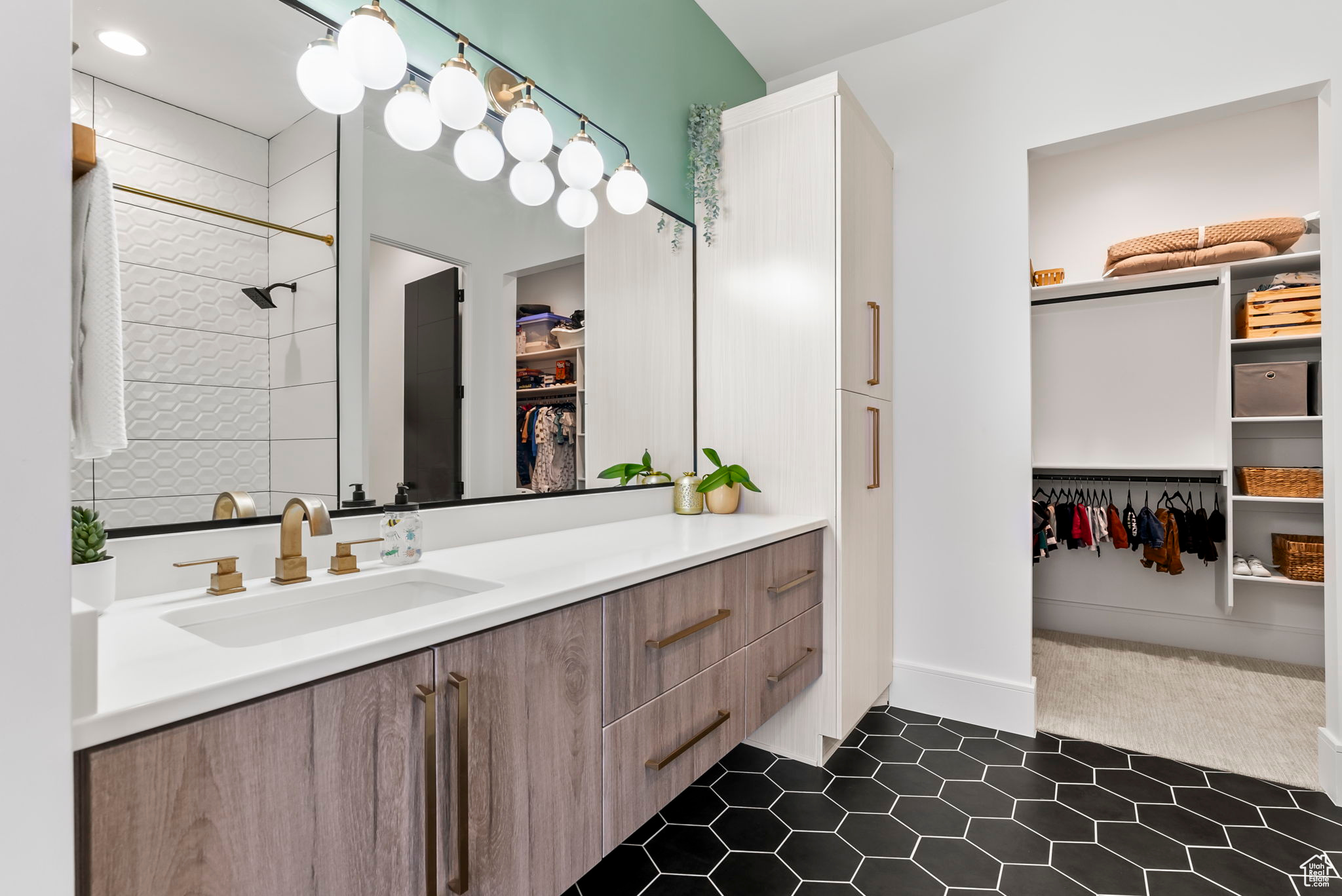 Bathroom with tile patterned flooring and vanity