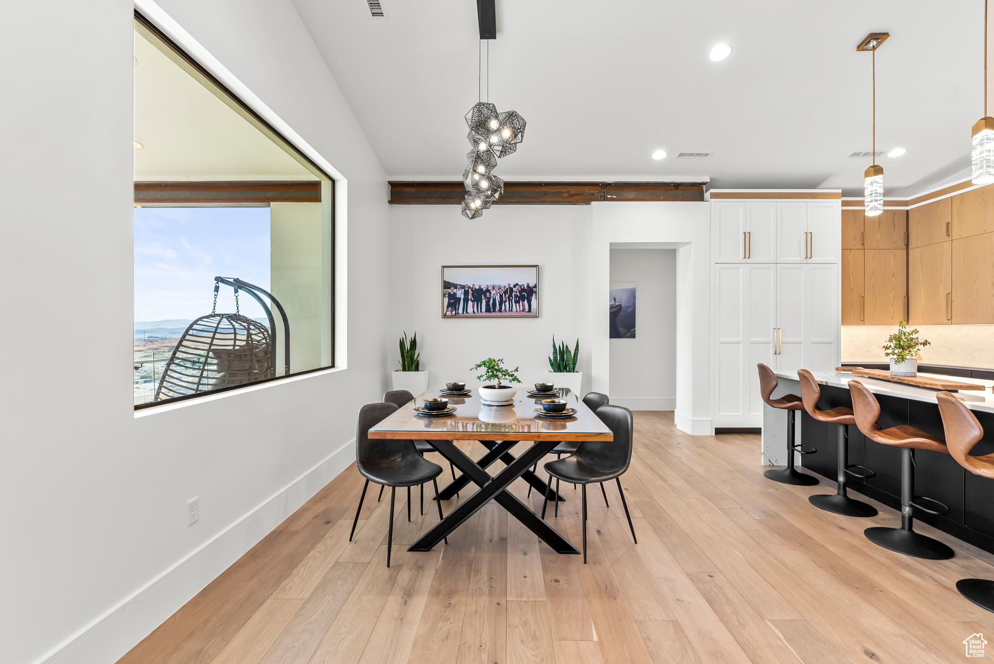 Dining space with light hardwood / wood-style flooring