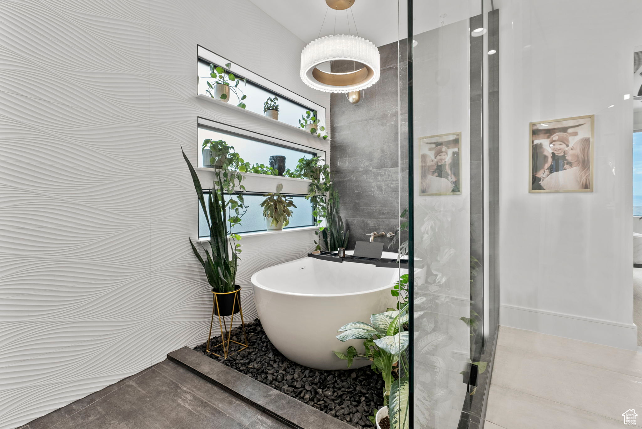 Bathroom featuring plus walk in shower and tile walls