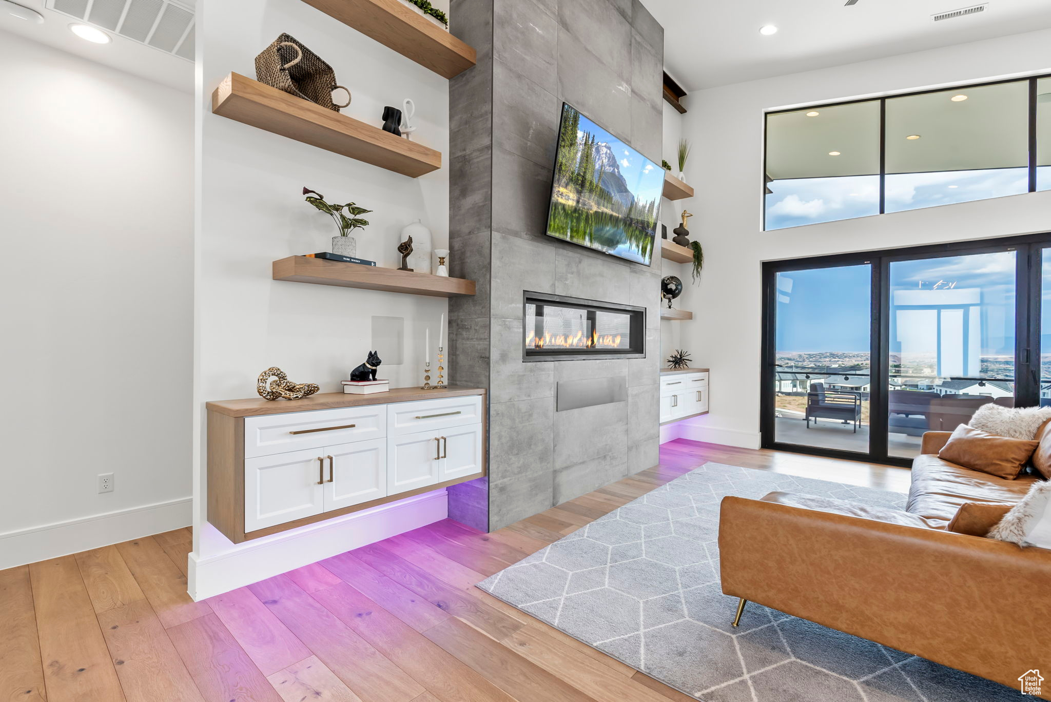 Living room featuring a fireplace and light hardwood / wood-style flooring