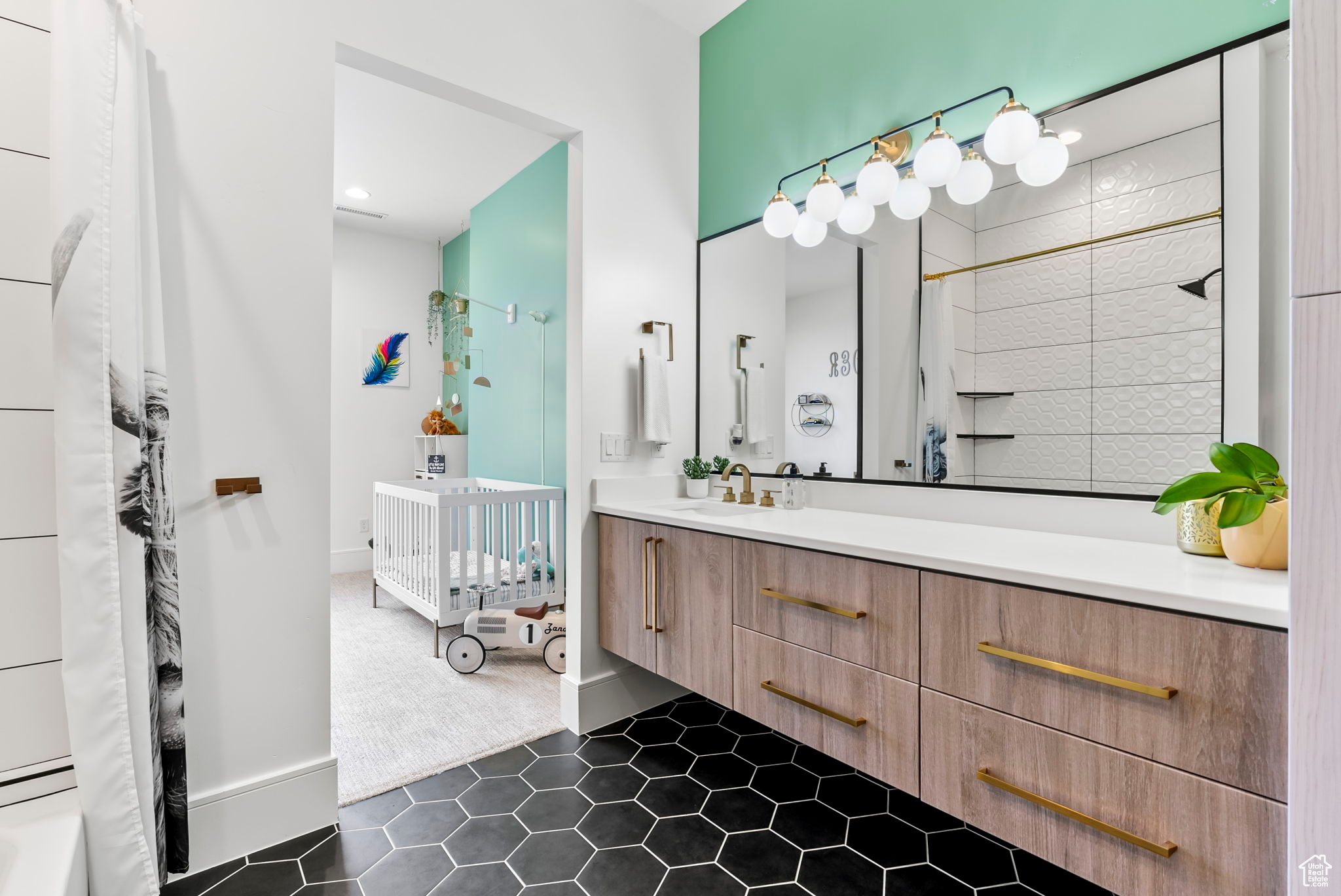 Bathroom featuring tile patterned flooring and vanity