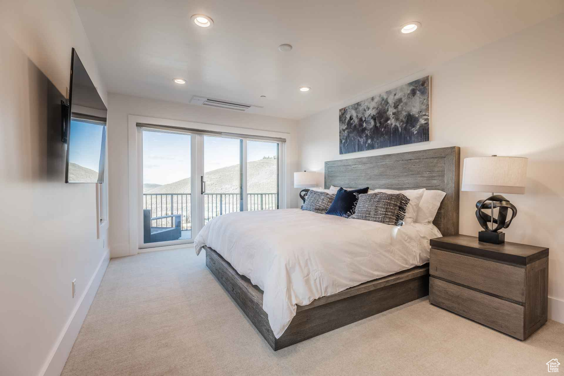 Carpeted bedroom featuring access to outside