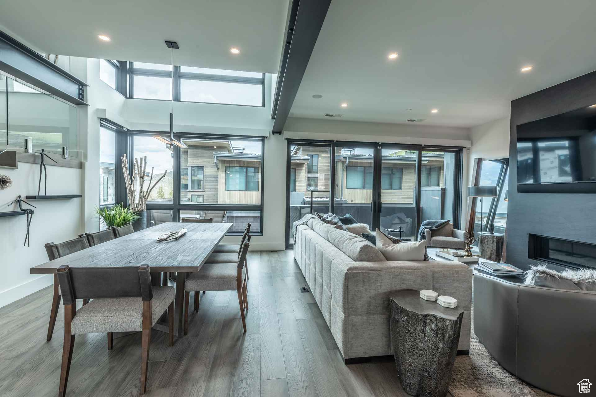 Living room with hardwood / wood-style floors and a healthy amount of sunlight