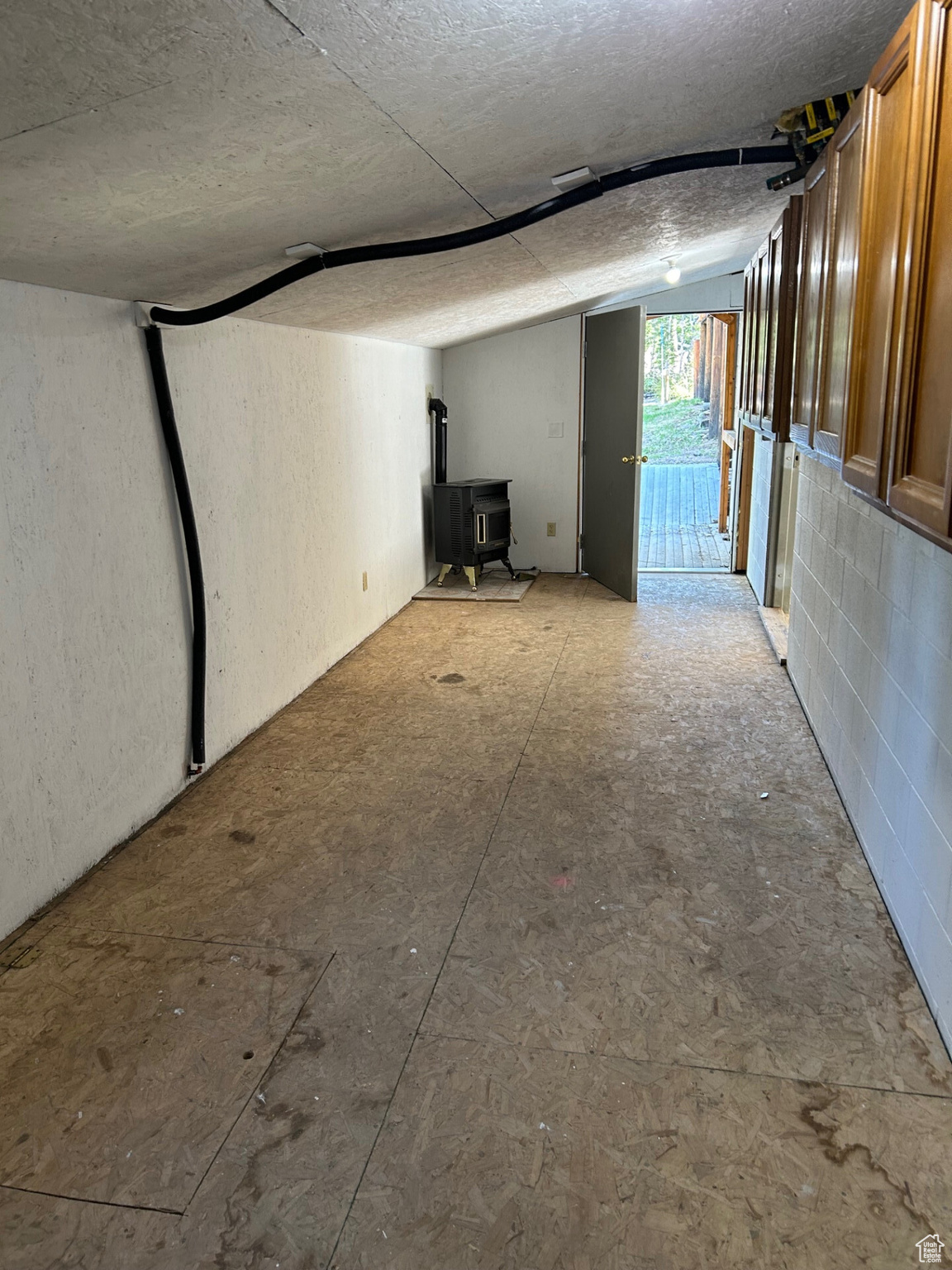 Basement featuring a wood stove