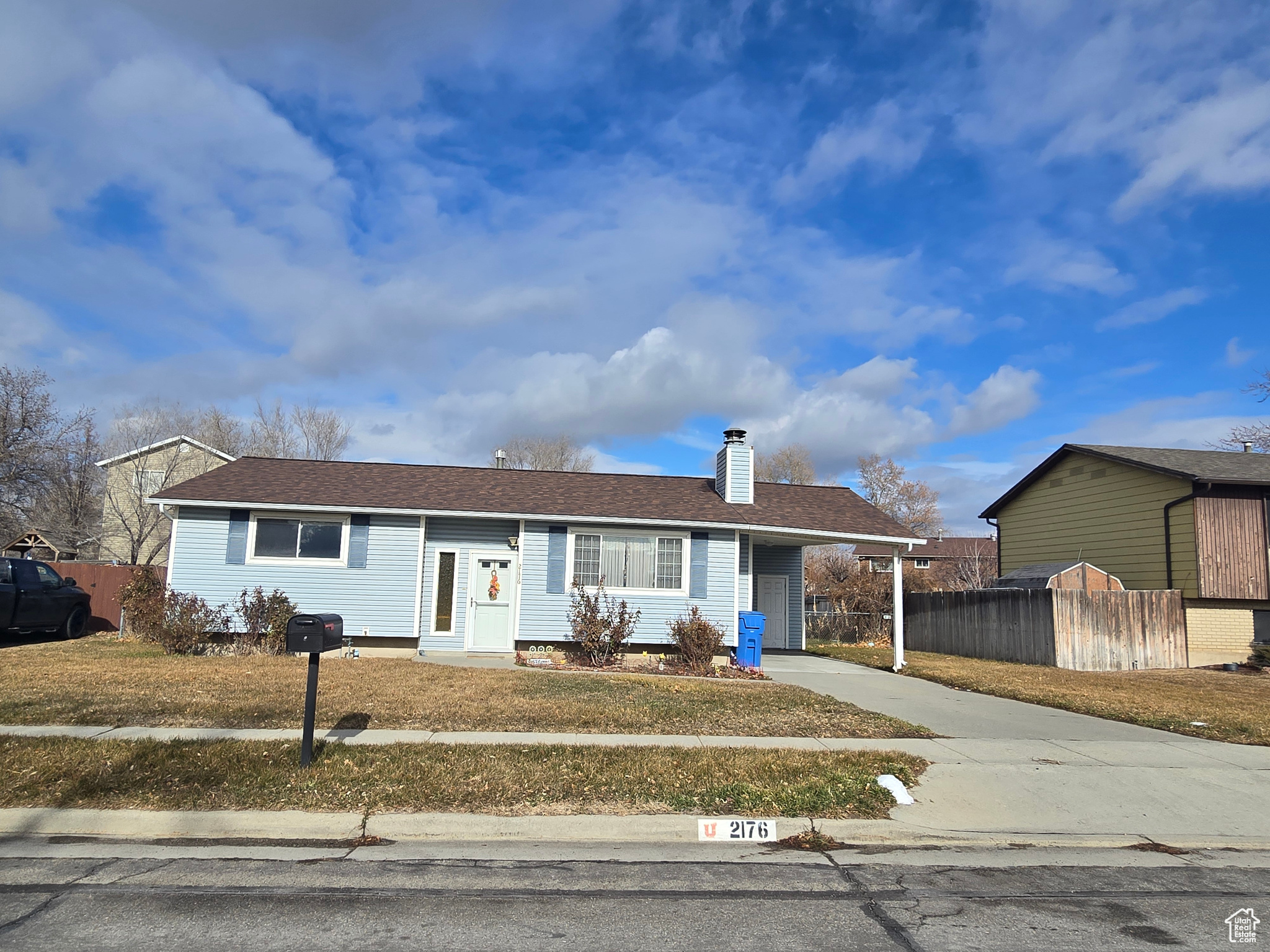 View of front of property with a carport