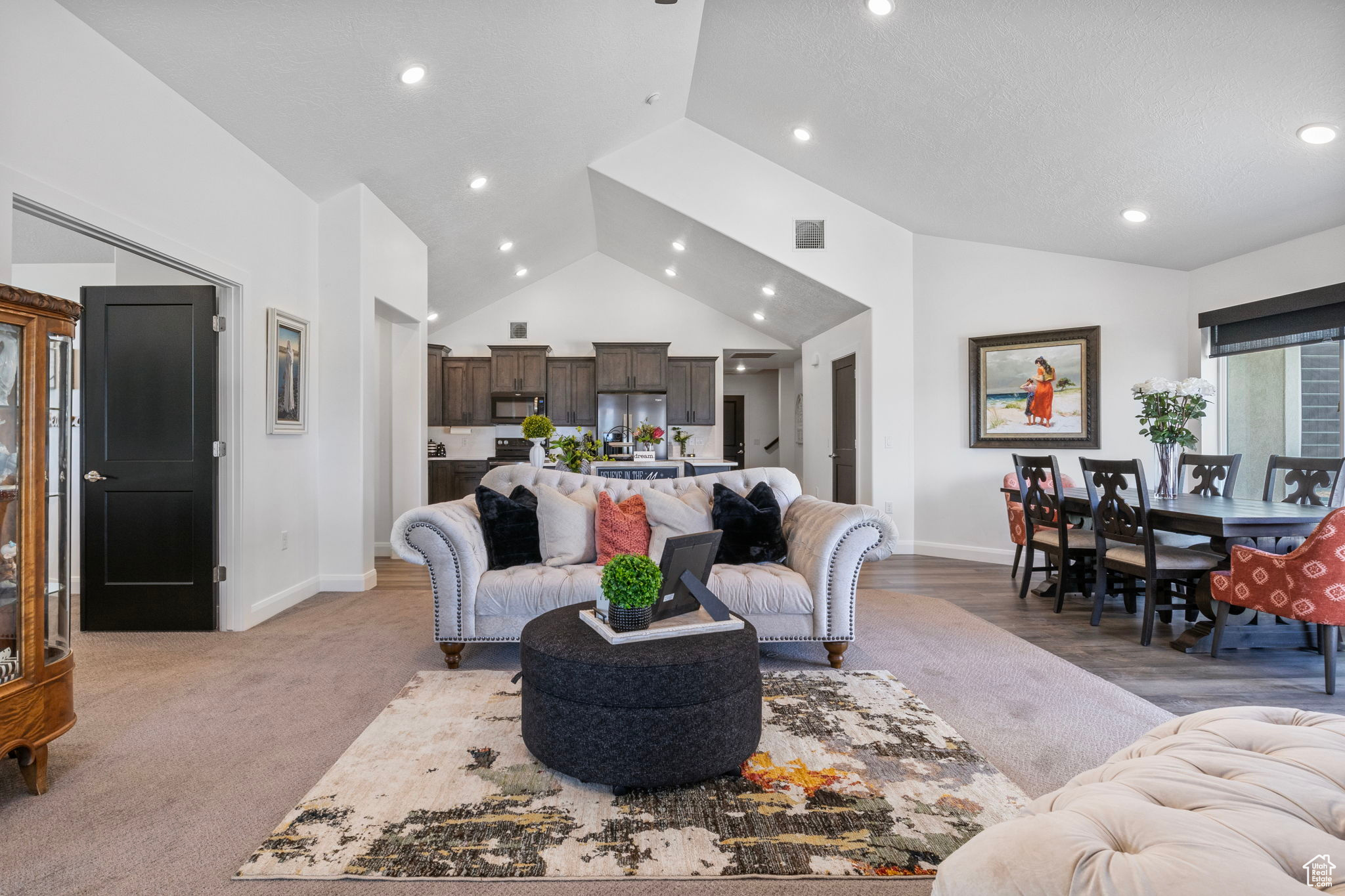 Living room featuring vaulted ceiling