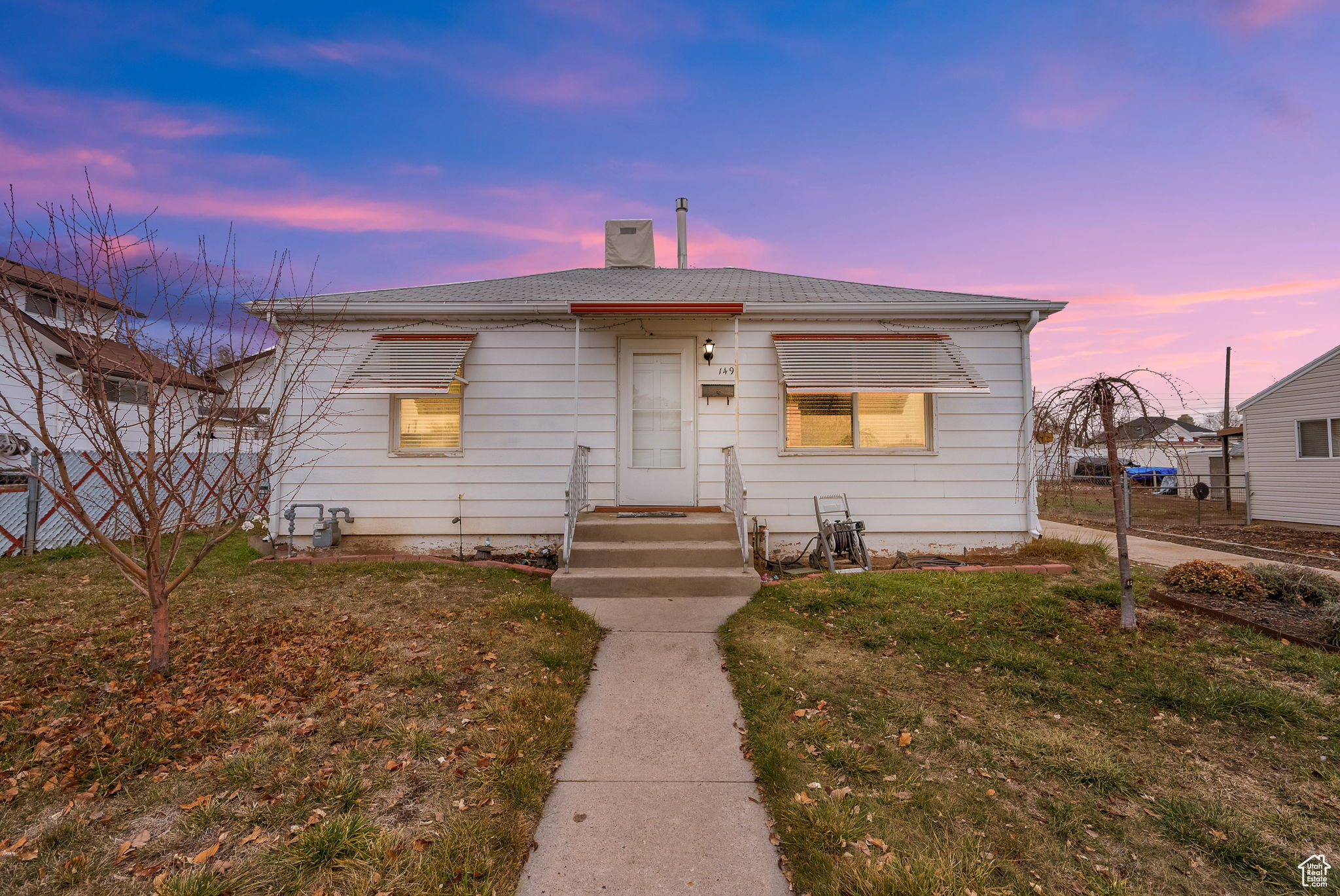 View of front of home featuring a lawn