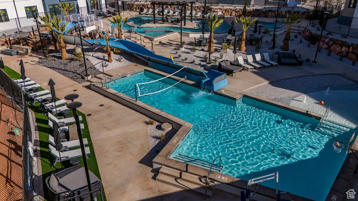 View of pool featuring a patio area and a water slide