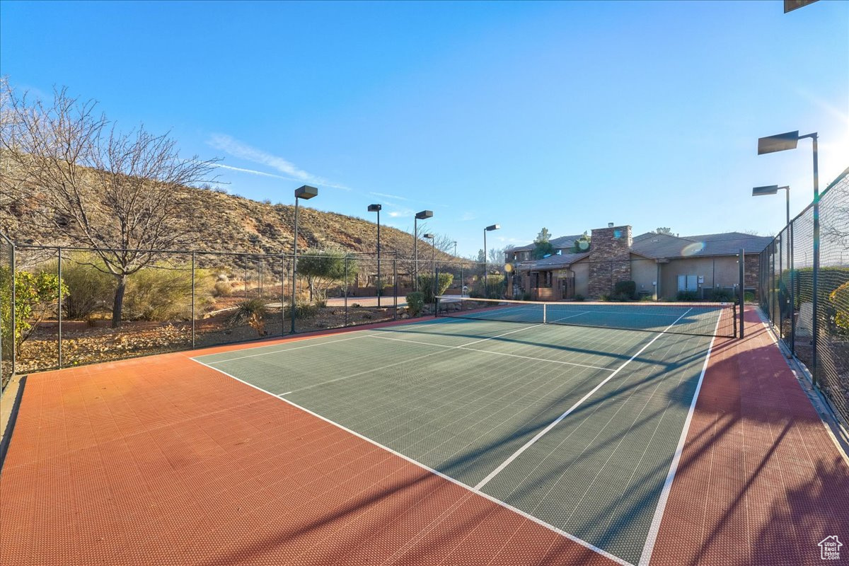 View of sport court featuring a mountain view and basketball court