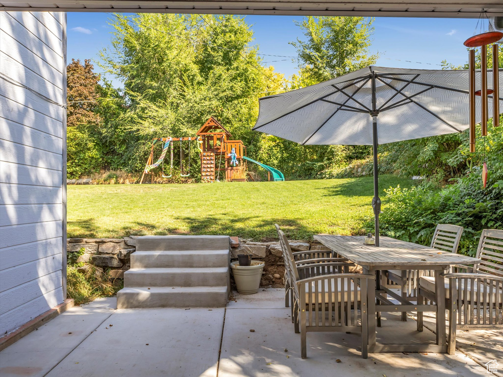 View of patio featuring a playground