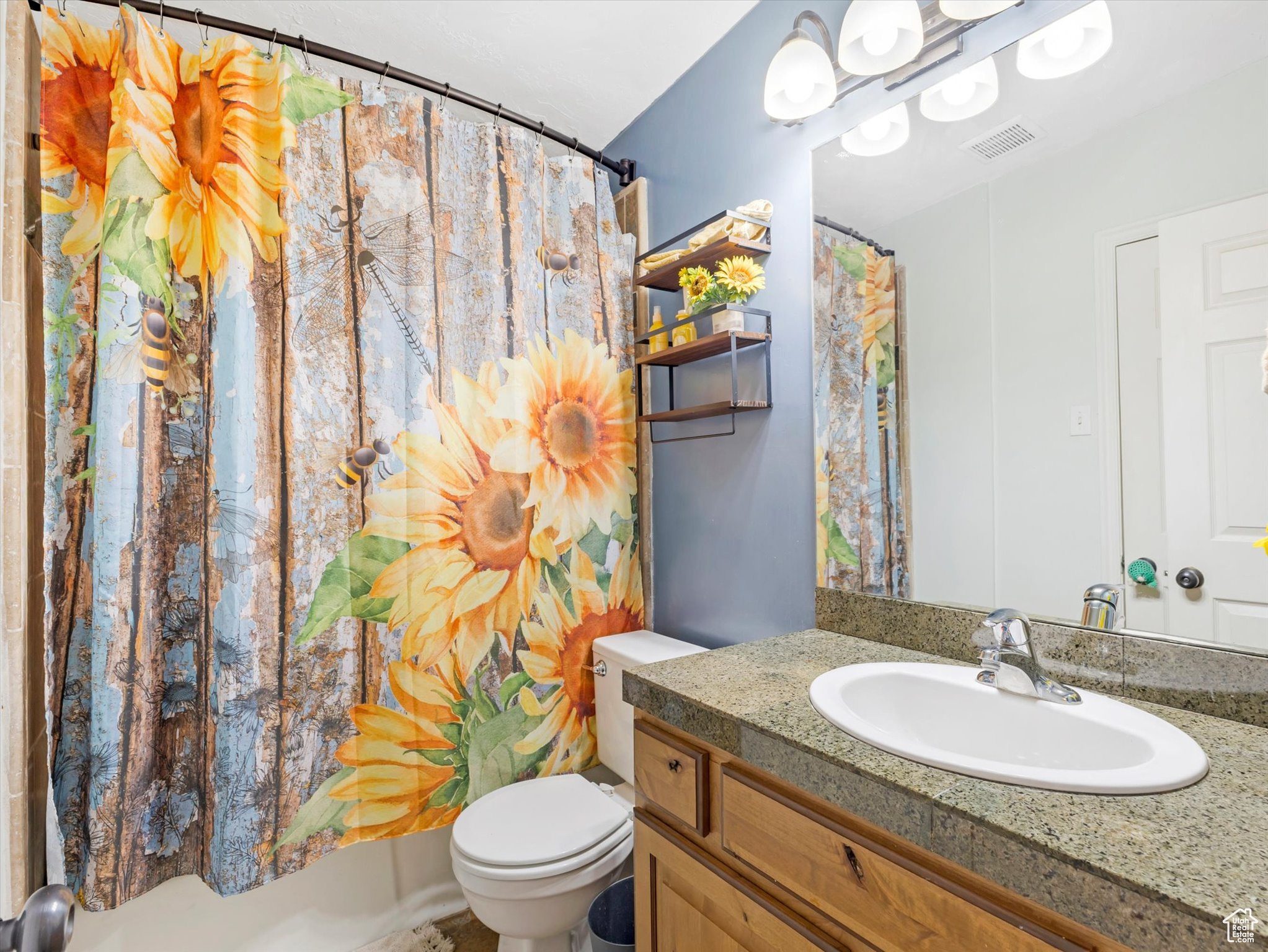 Bathroom with vanity and toilet