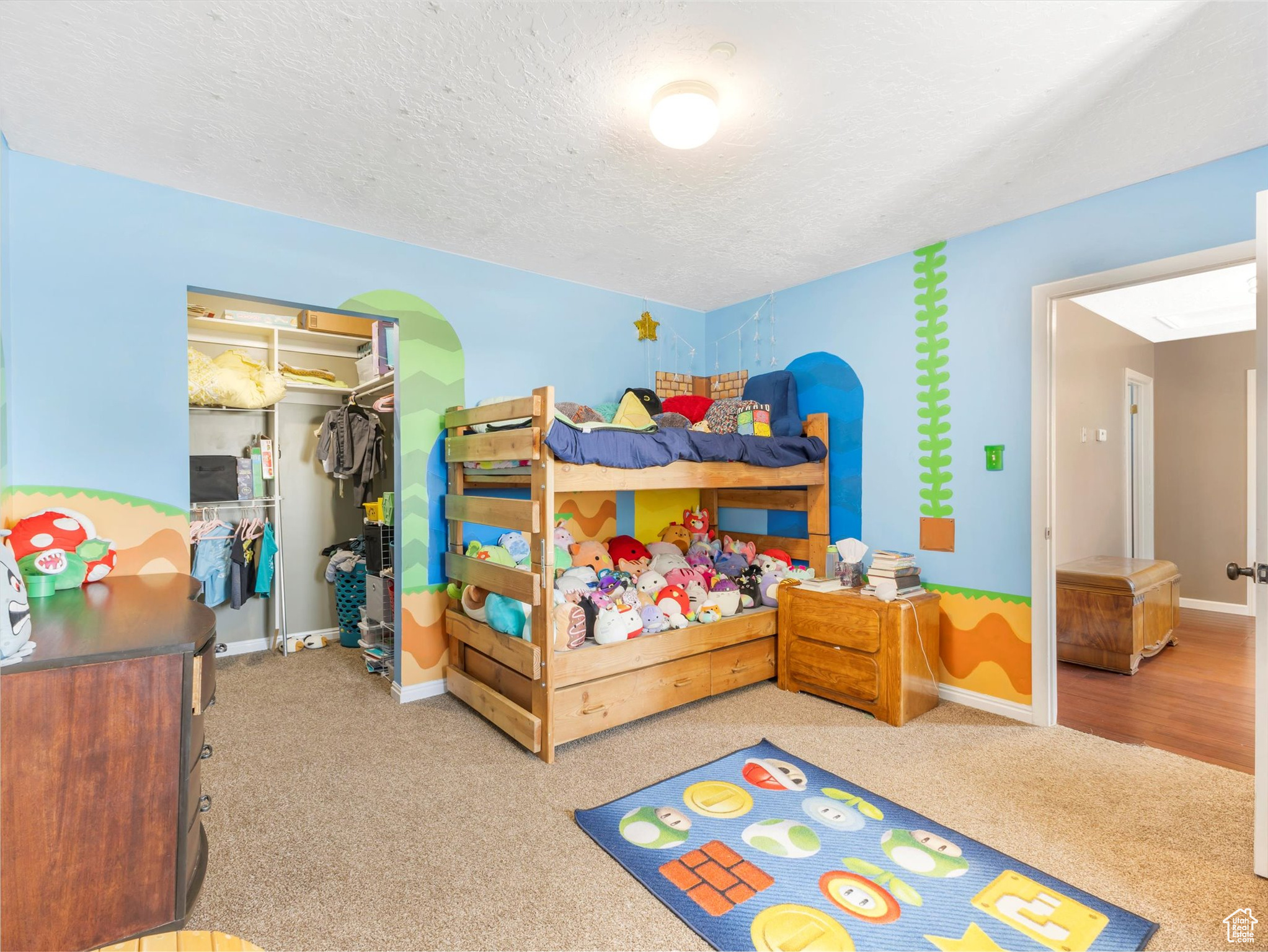 Bedroom #5 with a textured ceiling and a closet