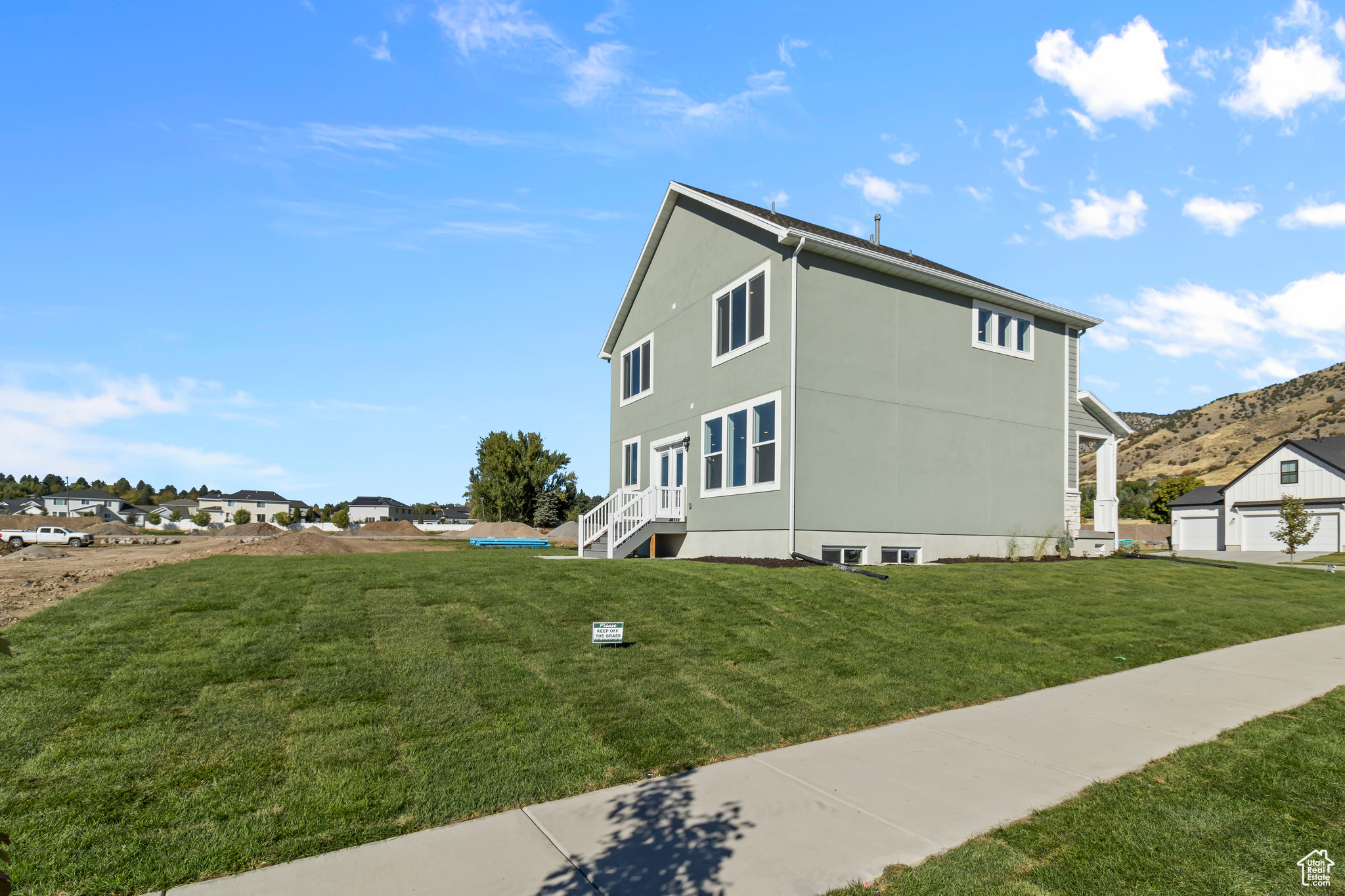 View of side of property featuring a yard