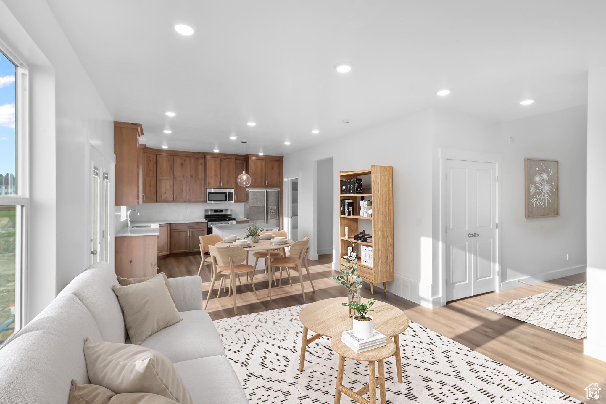 Living room with sink and light wood-type flooring