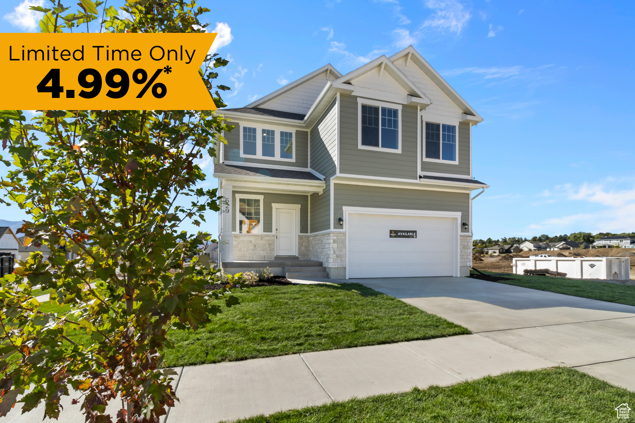 Craftsman-style house featuring a garage, a front yard, stone siding, and driveway