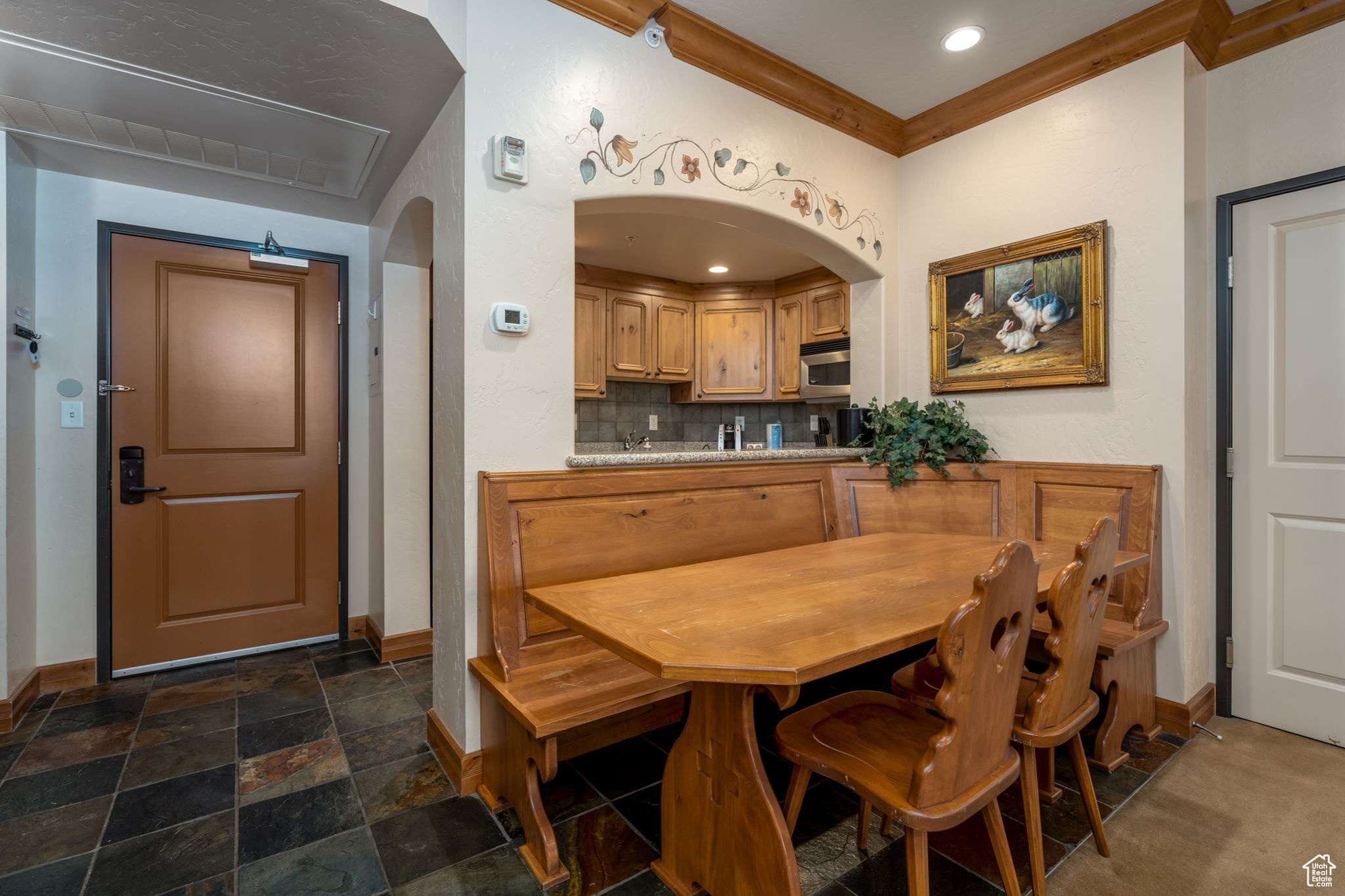 Dining area featuring ornamental molding