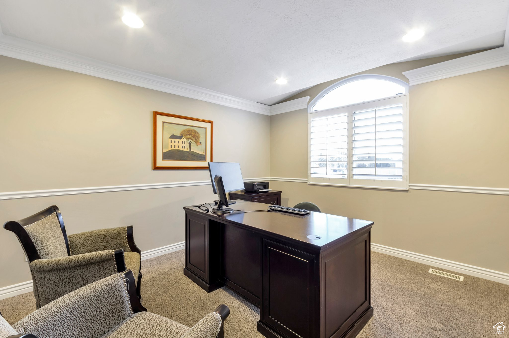 Carpeted office featuring ornamental molding