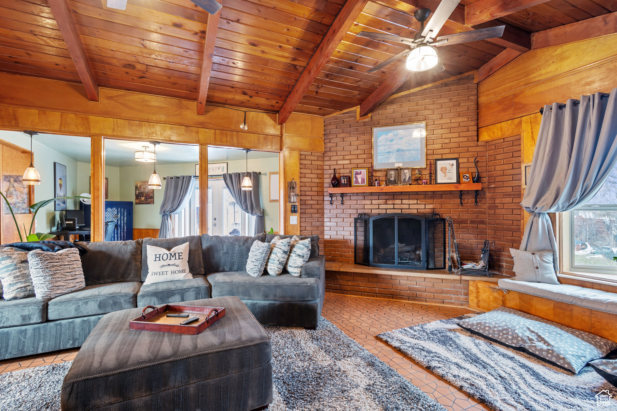 Living room with lofted ceiling and wooden beams