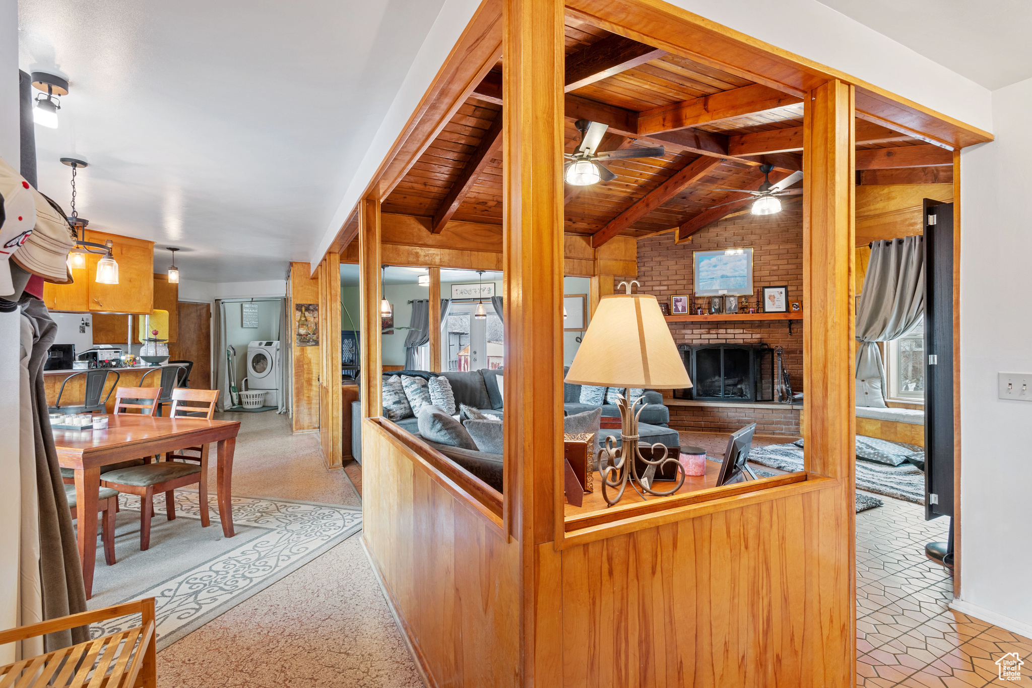 Living room with lofted ceiling and wooden beams