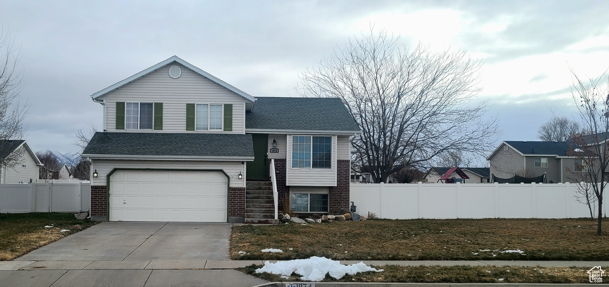 Split level home featuring a garage