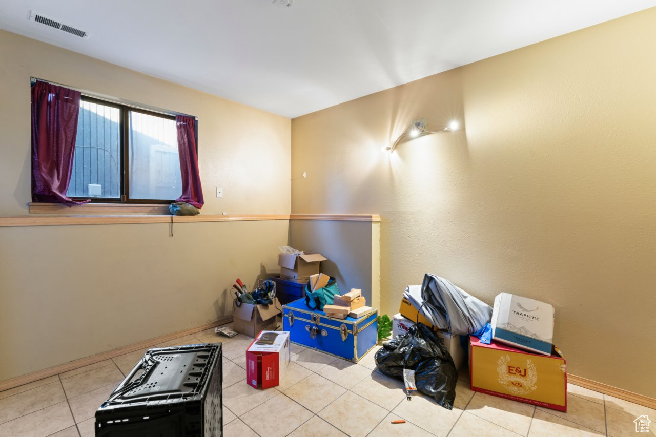 Interior space with light tile patterned floors