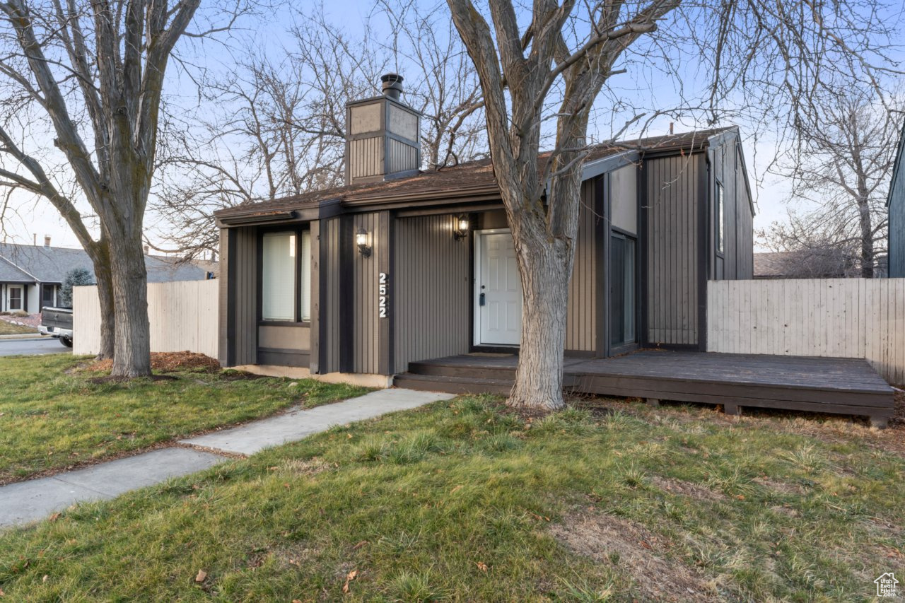 Exterior space with a front lawn