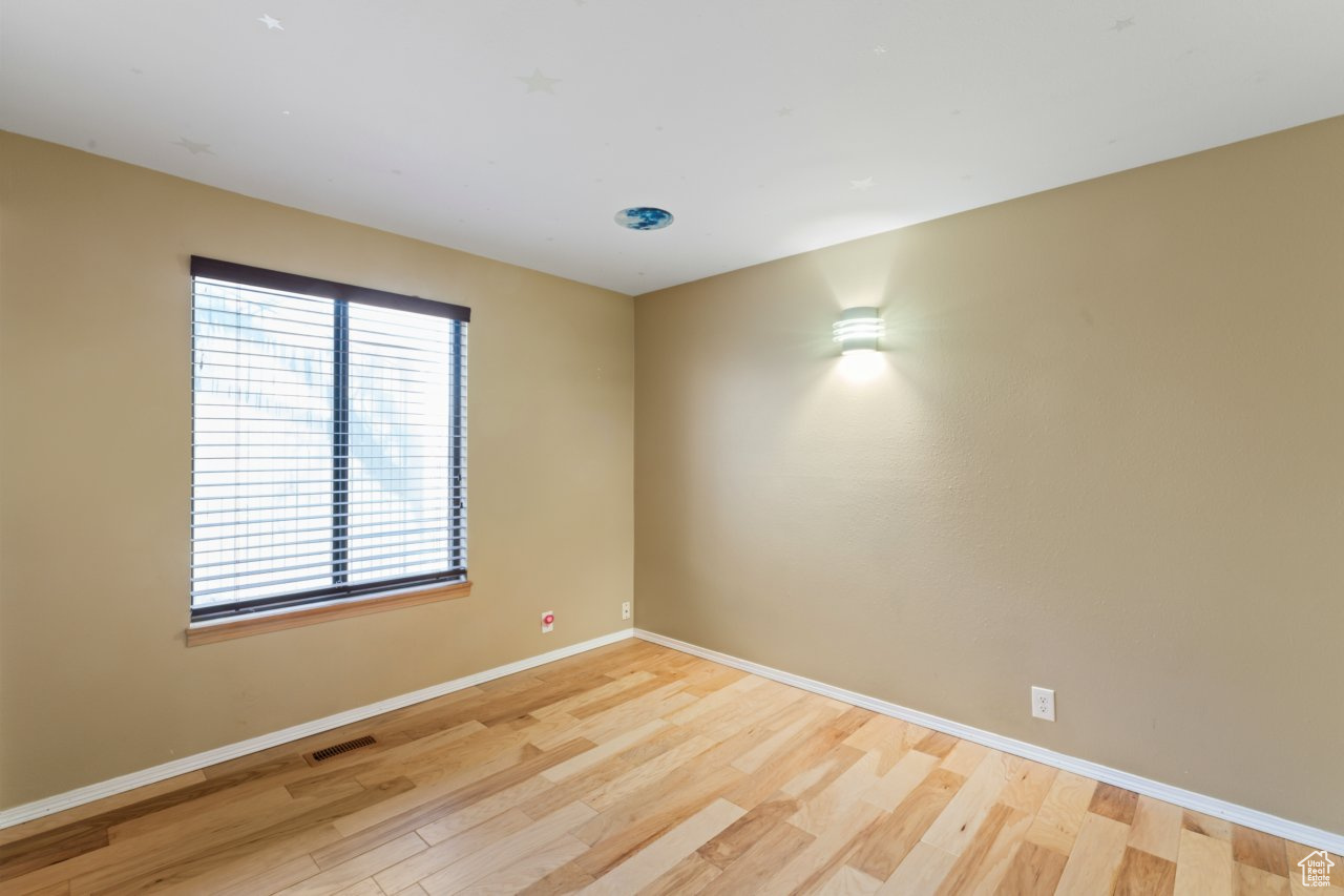 Spare room featuring light hardwood / wood-style flooring