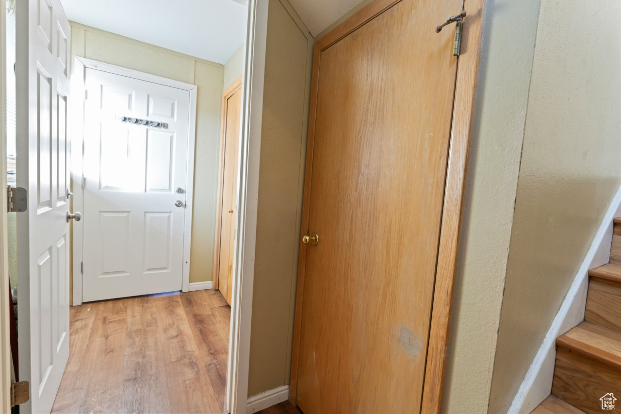 Hall featuring light hardwood / wood-style flooring