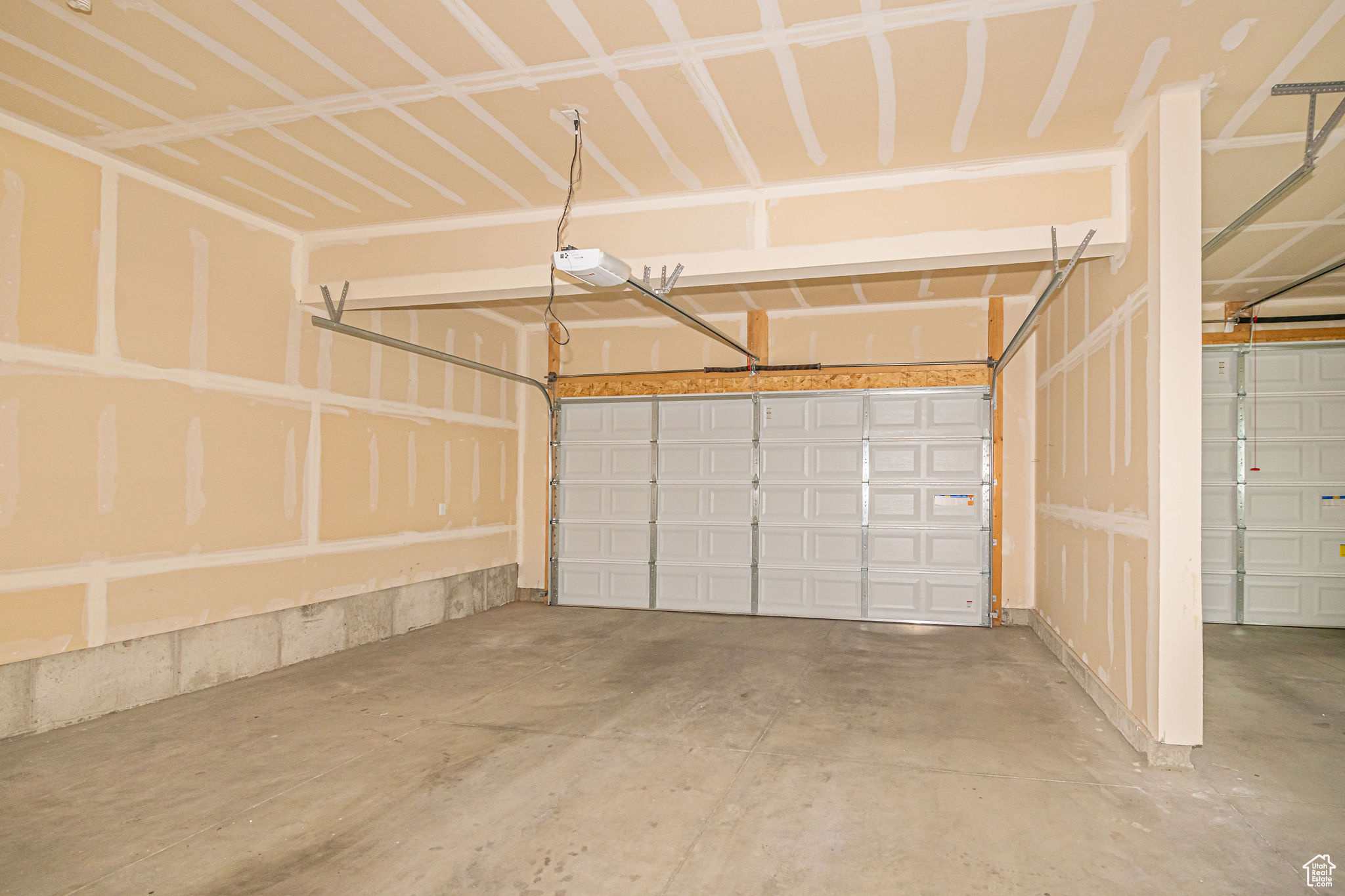 Garage featuring a garage door opener